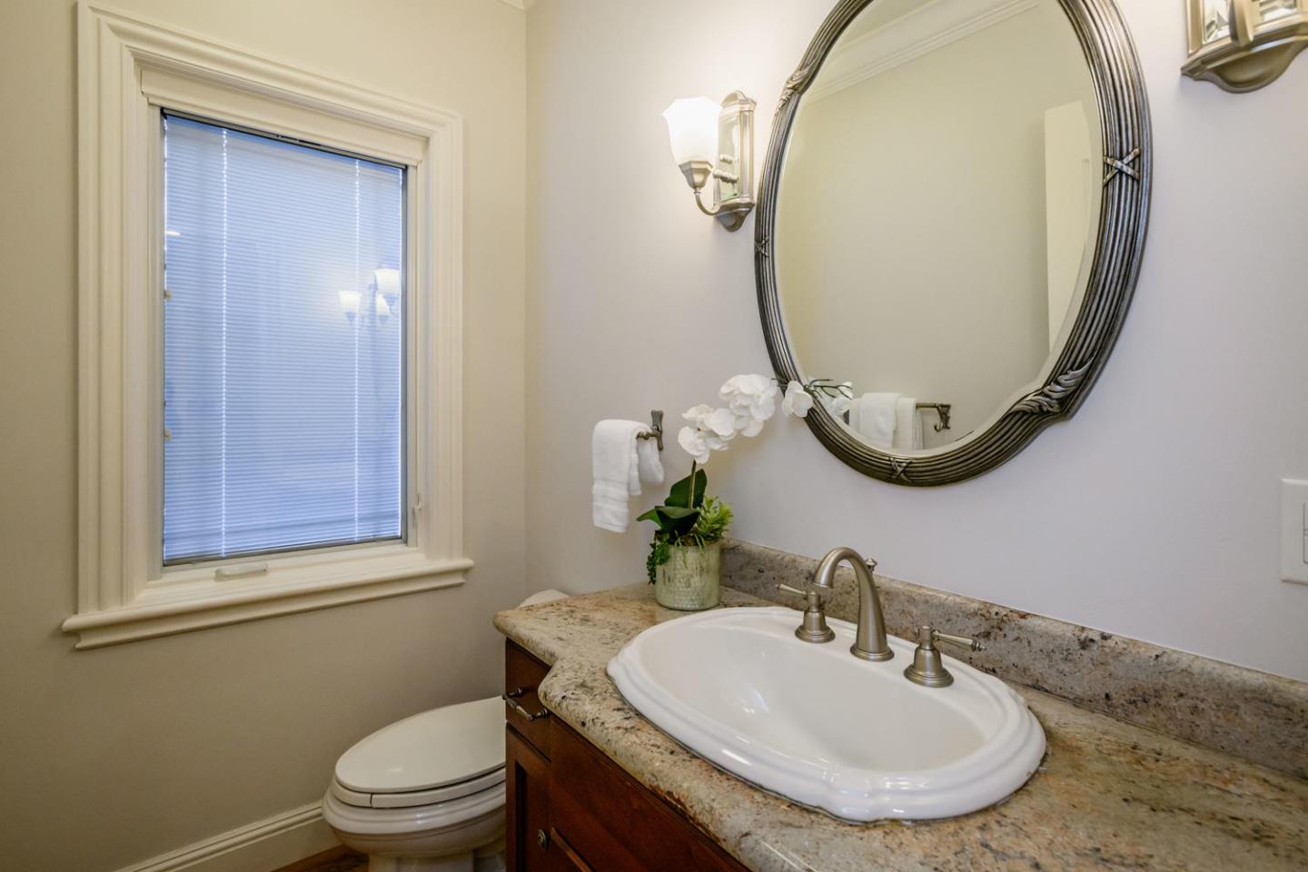 840 Newhall Road Burlingame, CA 94010 - Photo 18 of 41 a bathroom with a sink and a mirror