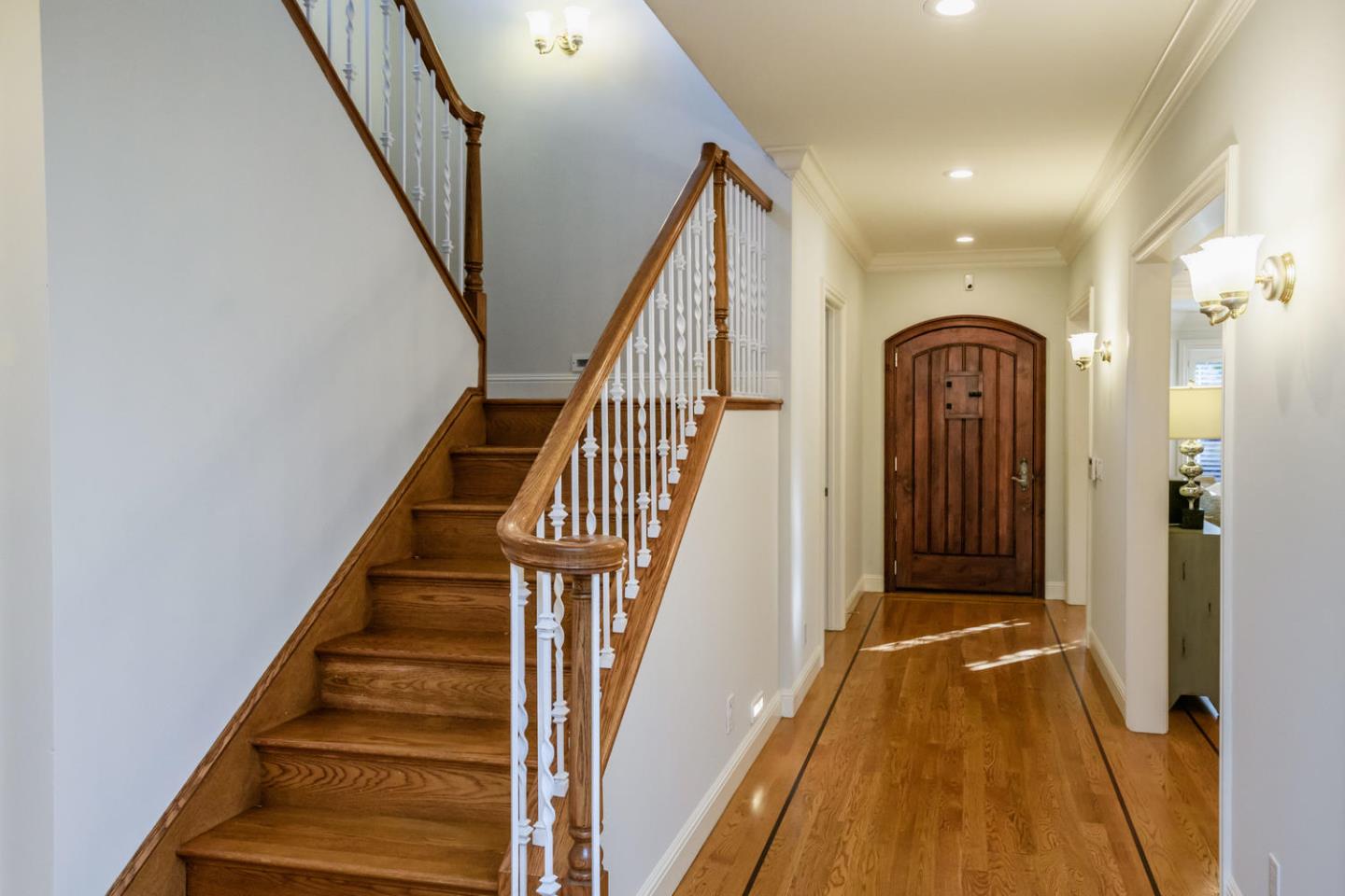 840 Newhall Road Burlingame, CA 94010 - Photo 21 of 41 a view of a hallway with wooden floor and staircase