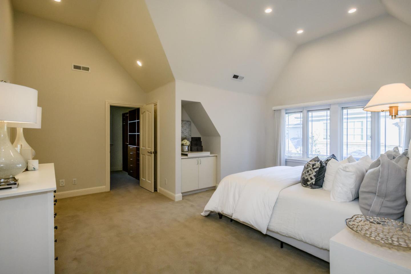 840 Newhall Road Burlingame, CA 94010 - Photo 23 of 41 a bedroom with a bed and a lamp