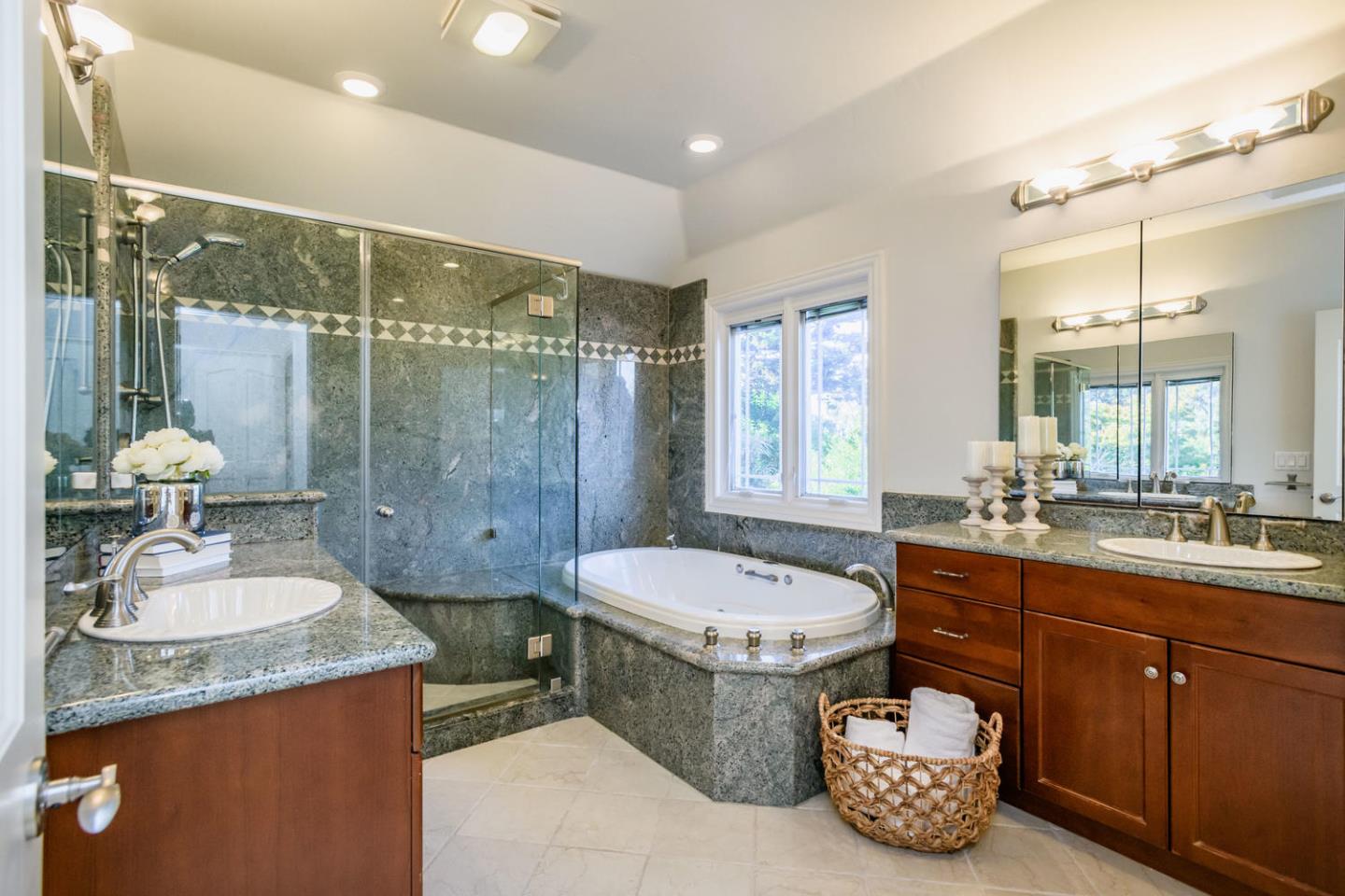 840 Newhall Road Burlingame, CA 94010 - Photo 26 of 41 a spacious bathroom with a granite countertop sink mirror and a bathtub