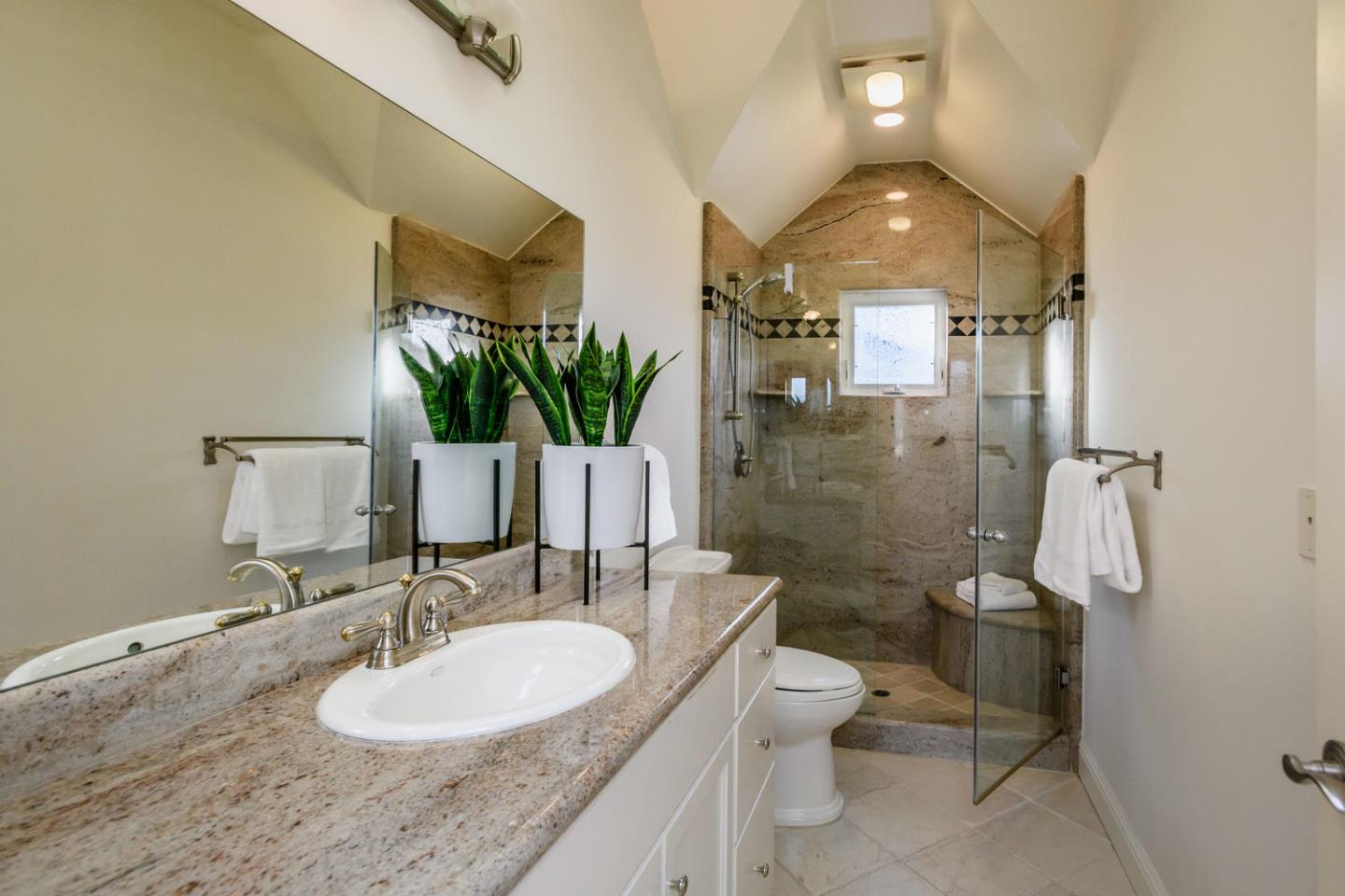 840 Newhall Road Burlingame, CA 94010 - Photo 29 of 41 a bathroom with a granite countertop sink toilet and shower