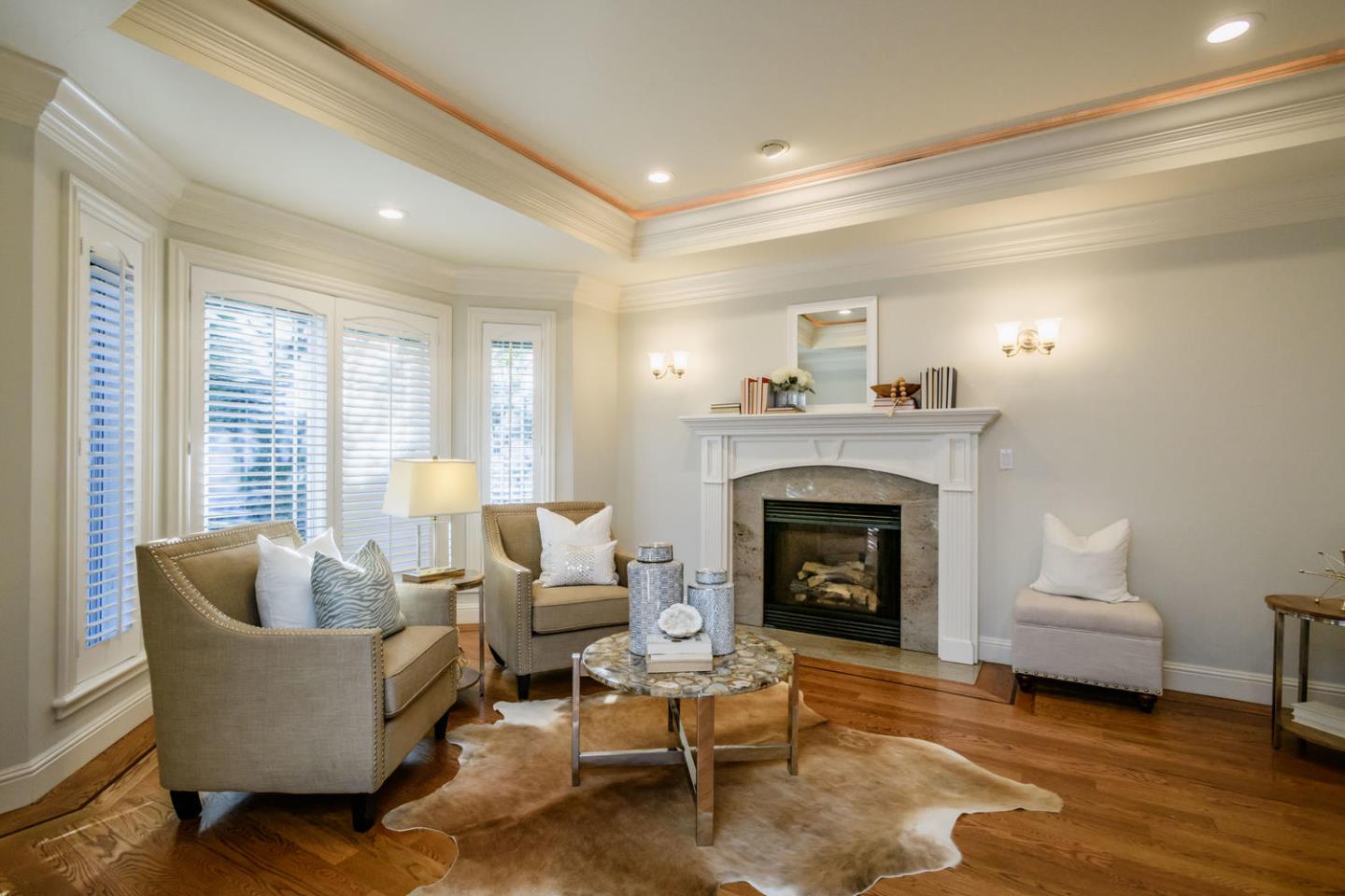 840 Newhall Road Burlingame, CA 94010 - Photo 4 of 41 a living room with furniture and a fireplace