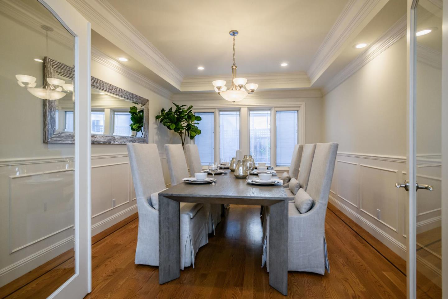 840 Newhall Road Burlingame, CA 94010 - Photo 7 of 41 a view of a dining room with furniture and a chandelier