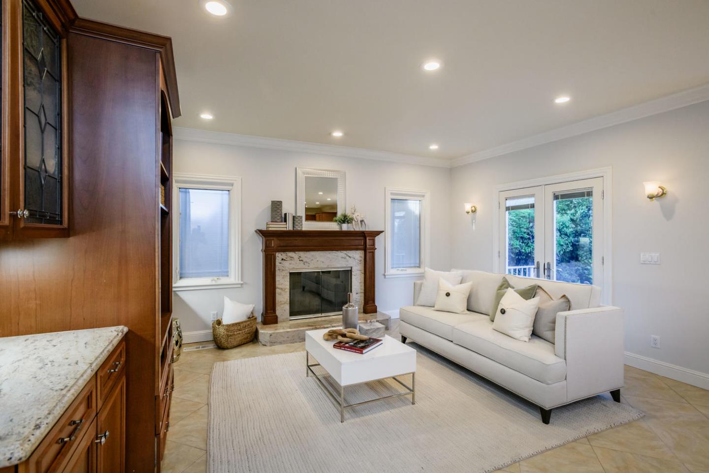 840 Newhall Road Burlingame, CA 94010 - Photo 8 of 41 a living room with furniture and a fireplace