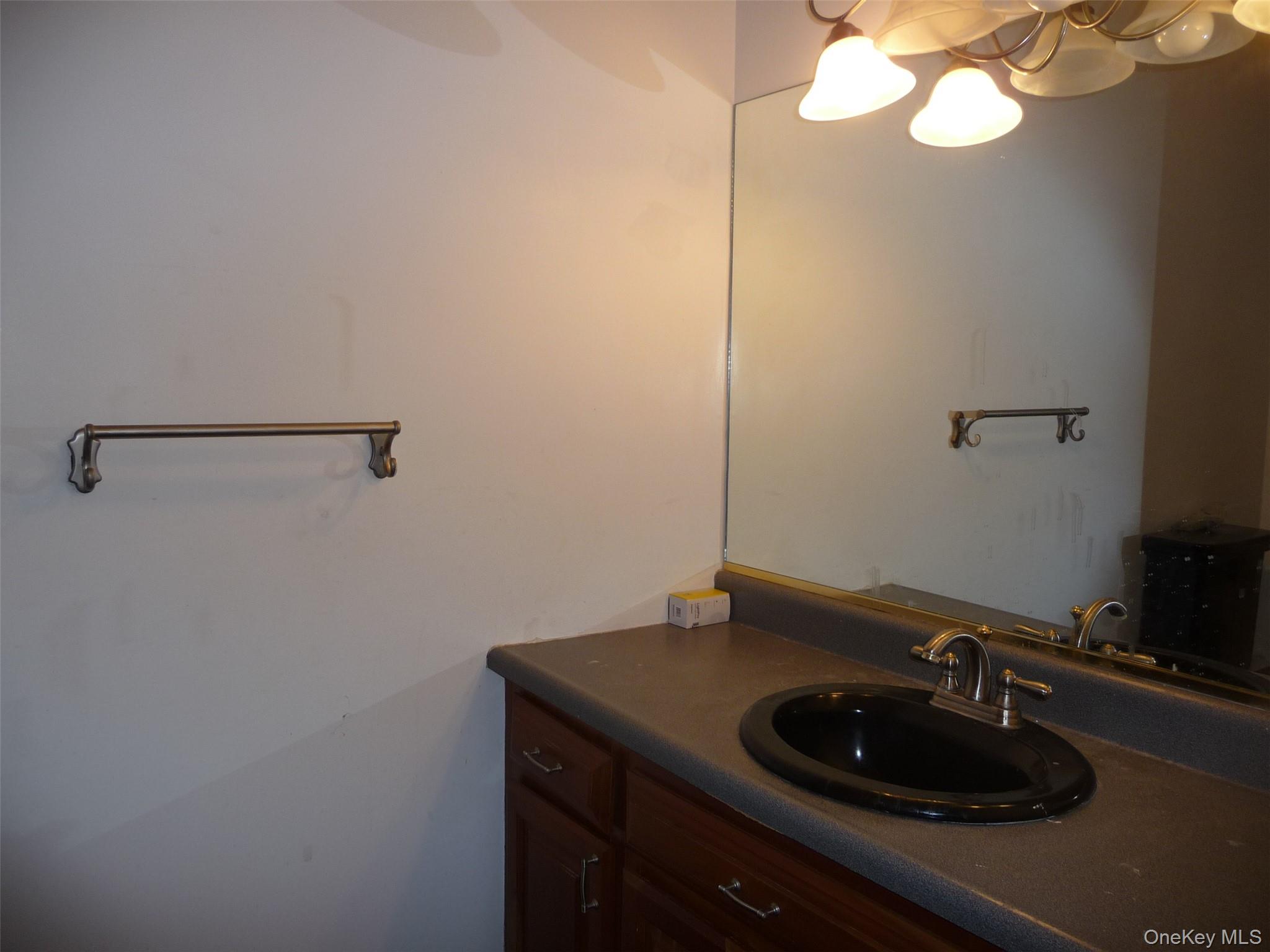 49 Lane Gate Road Wappingers Falls, NY 12590 - Photo 13 of 47 a bathroom with a sink and a mirror