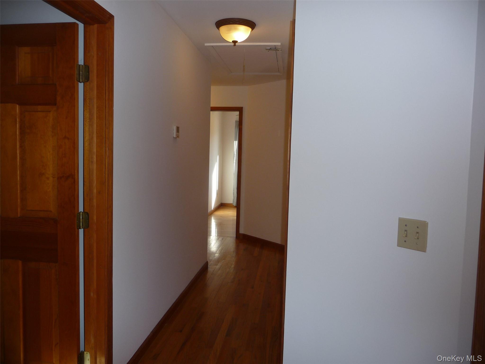 49 Lane Gate Road Wappingers Falls, NY 12590 - Photo 17 of 47 a view of a hallway with wooden floor