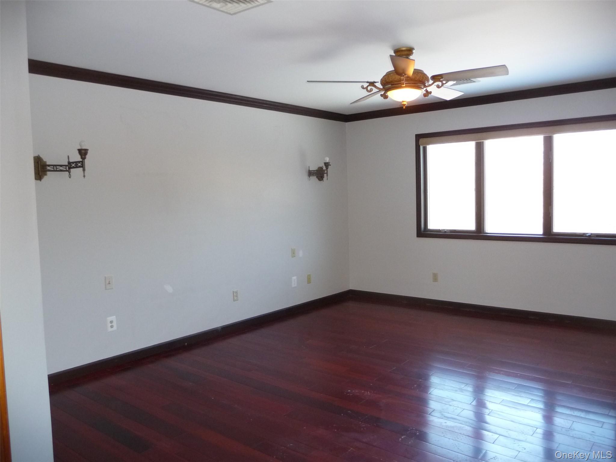 49 Lane Gate Road Wappingers Falls, NY 12590 - Photo 32 of 47 a view of an empty room with wooden floor and a window