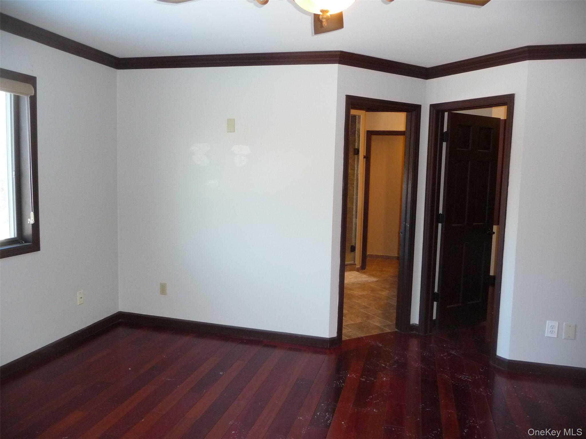 49 Lane Gate Road Wappingers Falls, NY 12590 - Photo 33 of 47 an empty room with wooden floor and closet