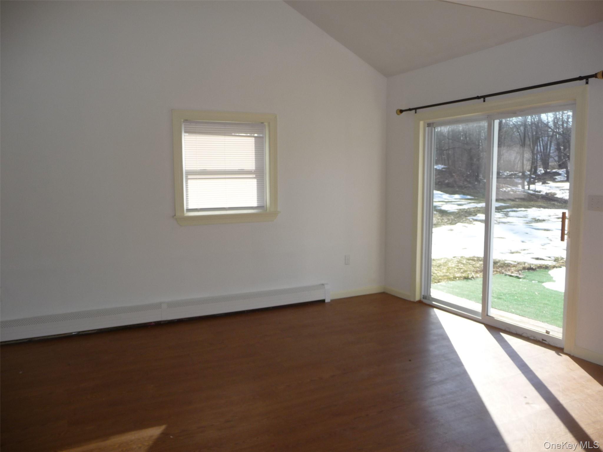 49 Lane Gate Road Wappingers Falls, NY 12590 - Photo 45 of 47 an empty room with wooden floor and windows