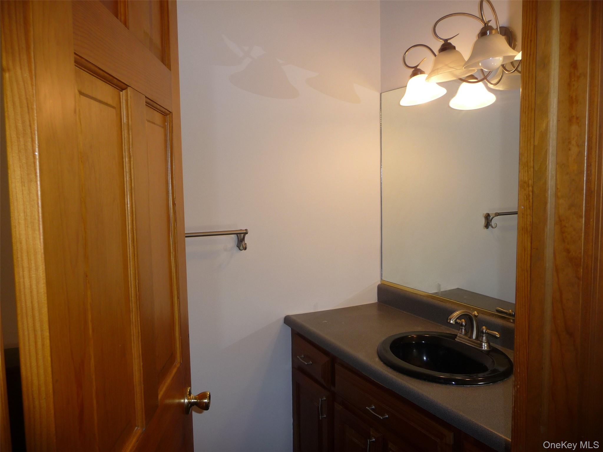 49 Lane Gate Road Wappingers Falls, NY 12590 - Photo 5 of 47 a bathroom with a sink and a mirror
