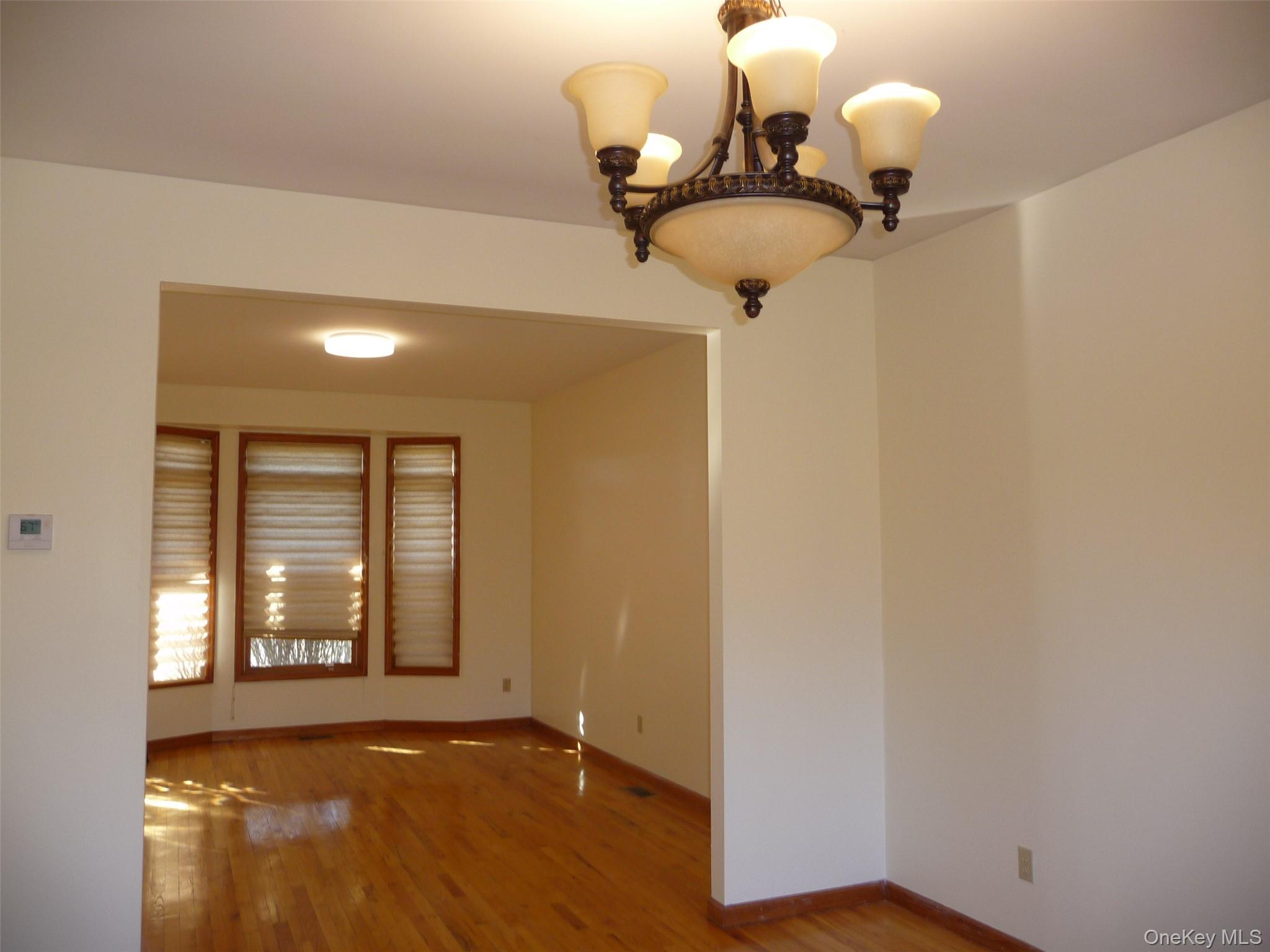 49 Lane Gate Road Wappingers Falls, NY 12590 - Photo 8 of 47 a view of a room with a window and wooden floor