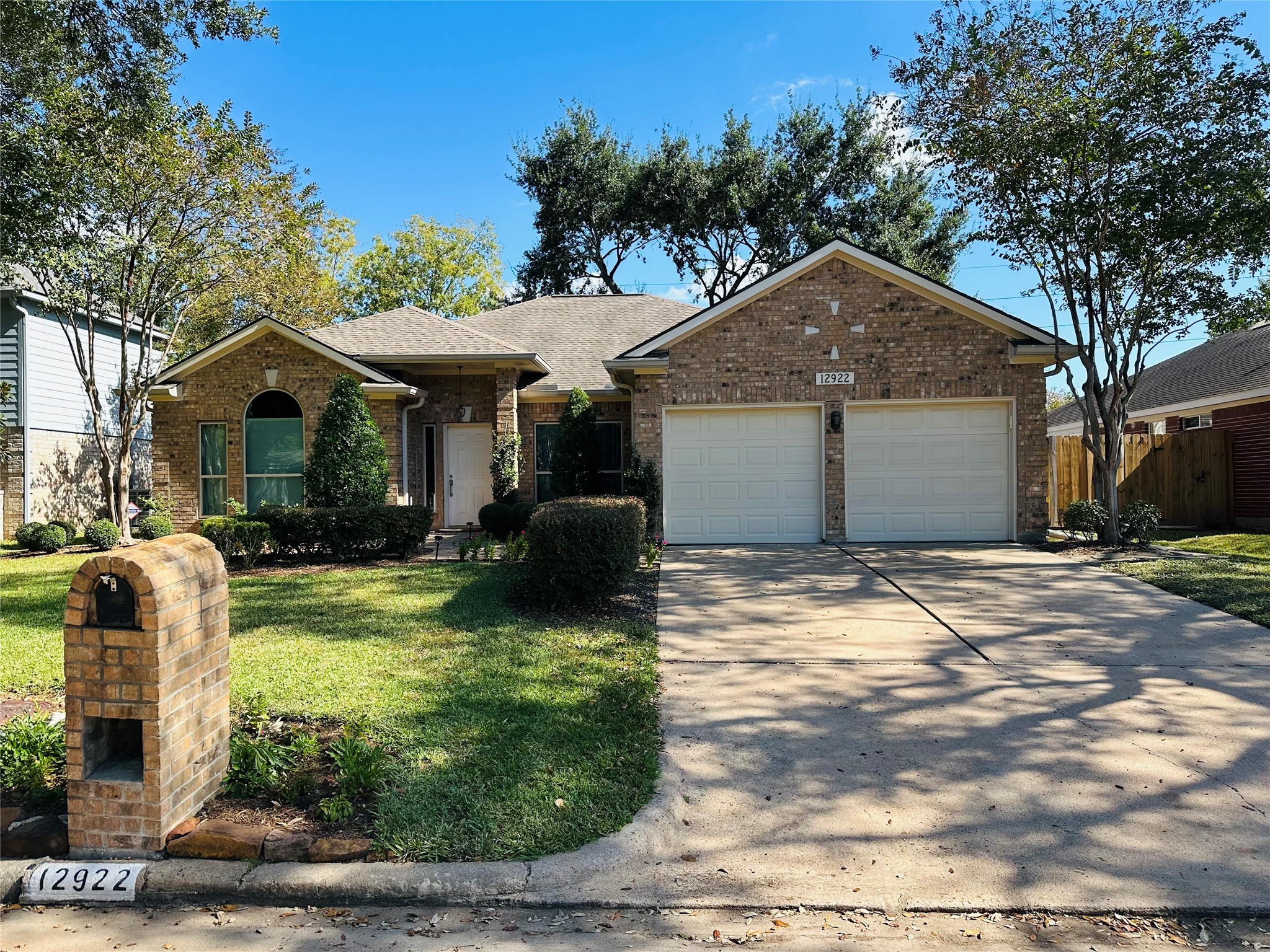 12922 Mills Bend Street Houston, TX 77070 - Photo 2 of 50 a front view of a house with garden