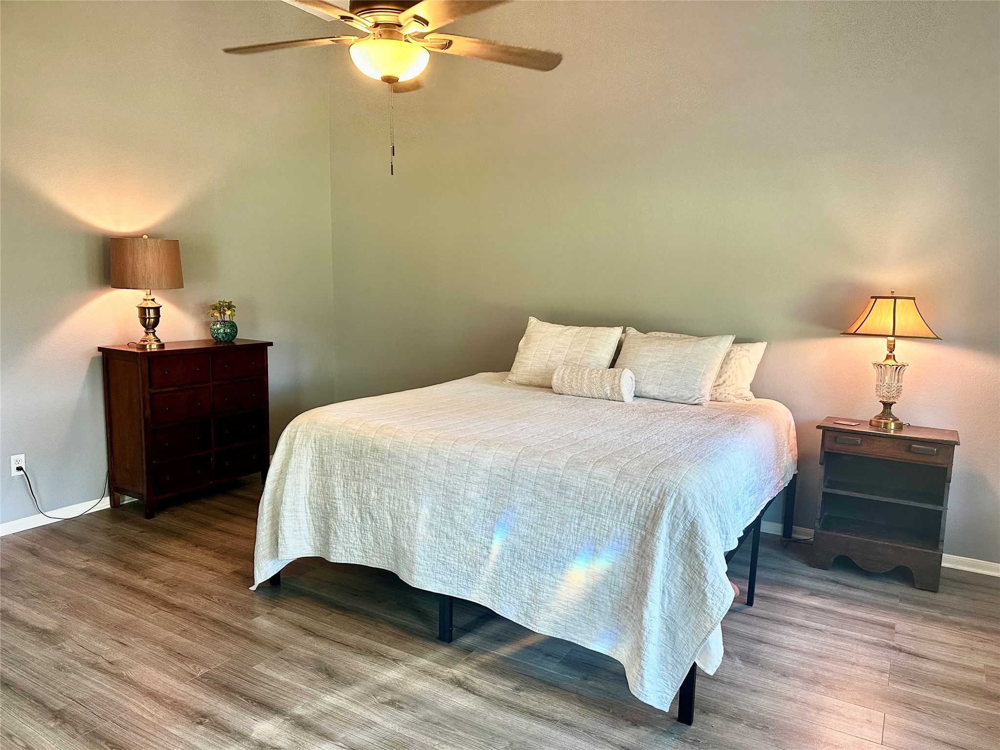 12922 Mills Bend Street Houston, TX 77070 - Photo 25 of 50 a bedroom with a bed and wooden floor