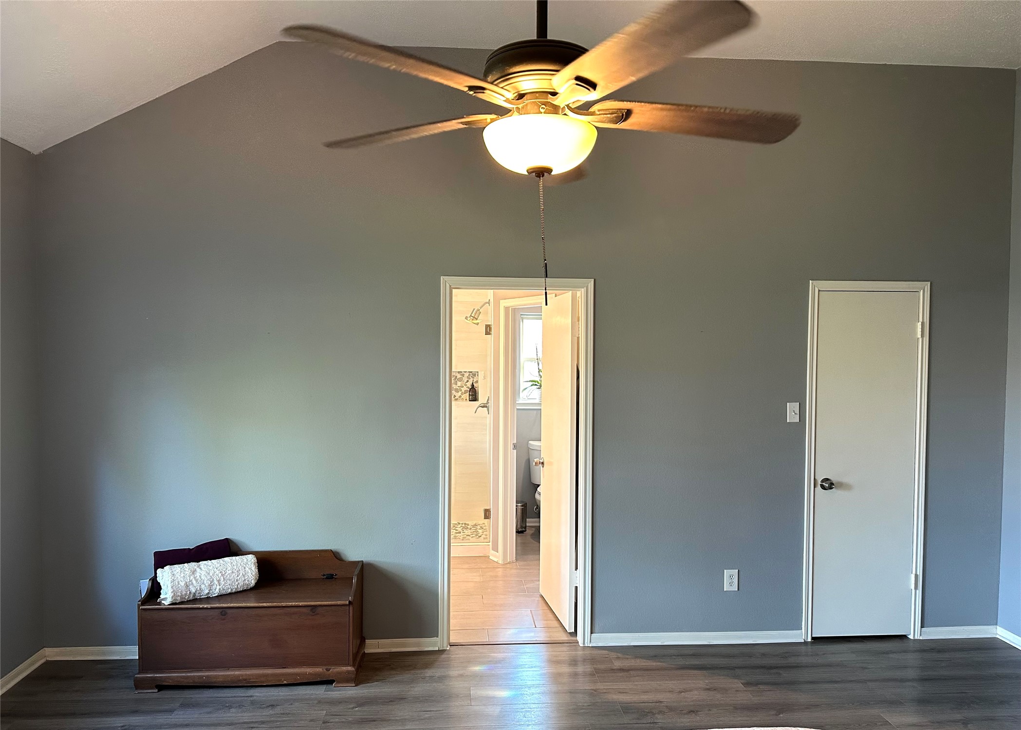 12922 Mills Bend Street Houston, TX 77070 - Photo 28 of 50 a room with wooden floor and ceiling fan