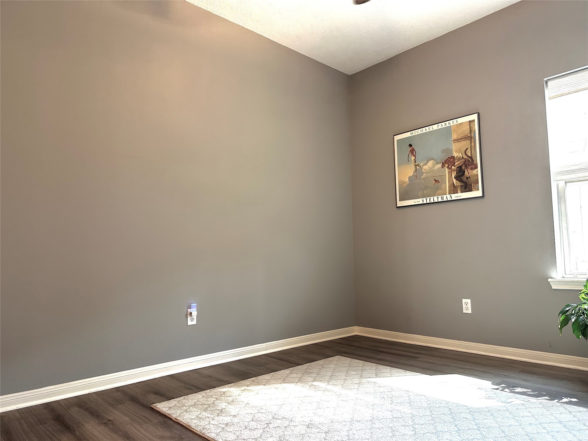 12922 Mills Bend Street Houston, TX 77070 - Photo 35 of 50 an empty room with wooden floor and windows