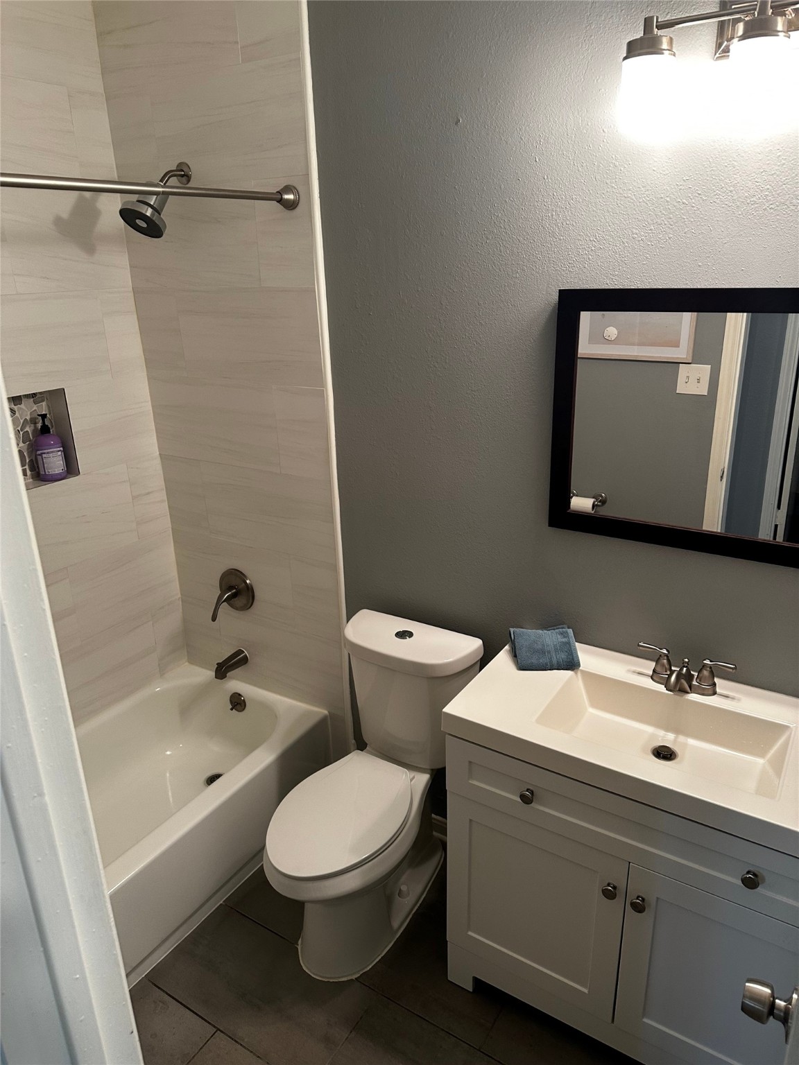 12922 Mills Bend Street Houston, TX 77070 - Photo 41 of 50 a bathroom with a toilet sink and mirror