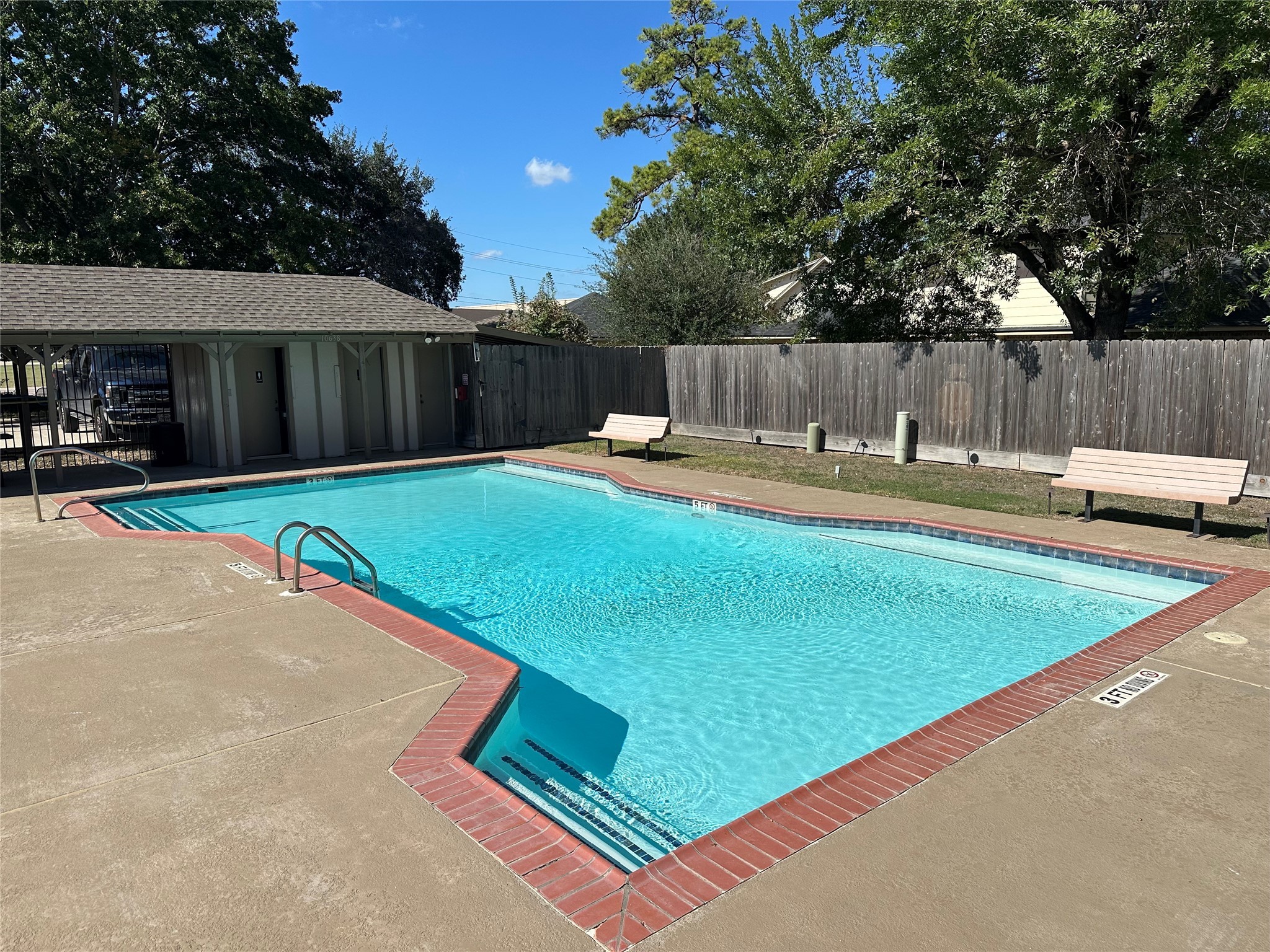 12922 Mills Bend Street Houston, TX 77070 - Photo 46 of 50 a swimming pool with wooden fence