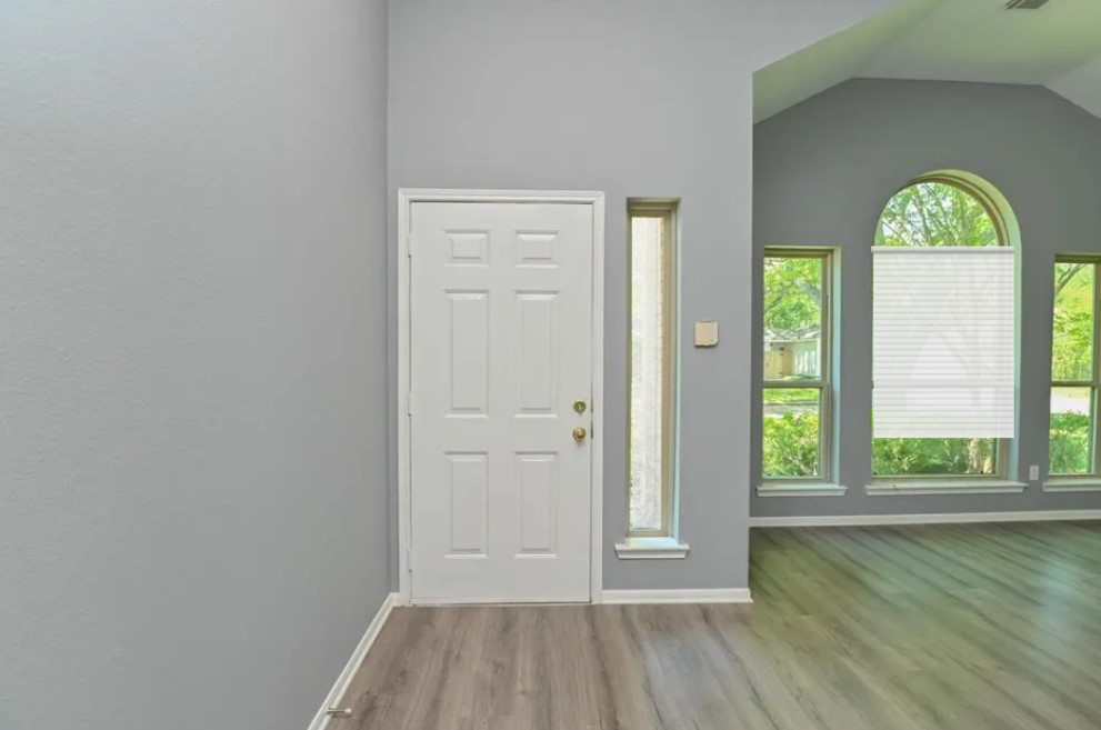 12922 Mills Bend Street Houston, TX 77070 - Photo 9 of 50 wooden floor in an empty room with a window