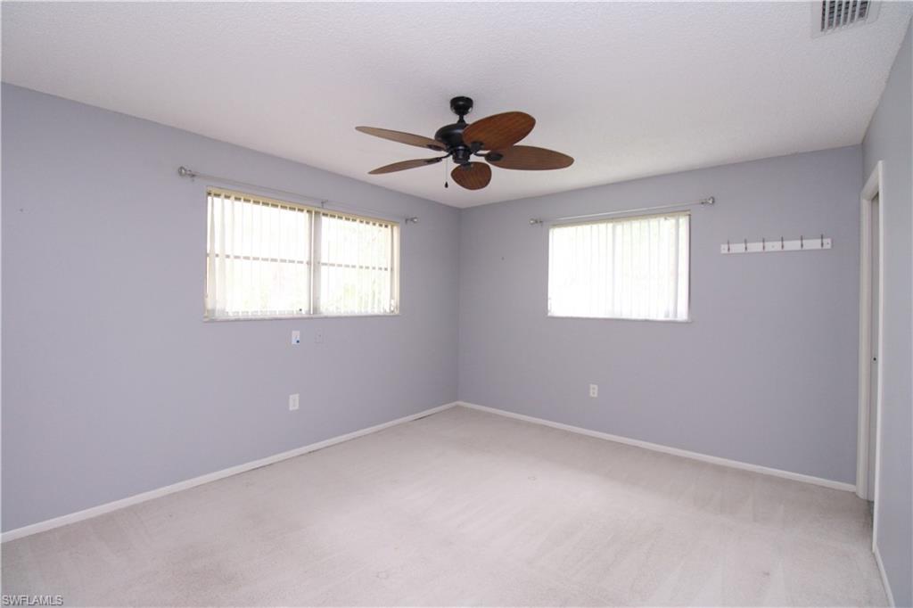 729 Palm View Drive, Unit D4 Naples, FL 34110 - Photo 13 of 23 a view of an empty room with a window