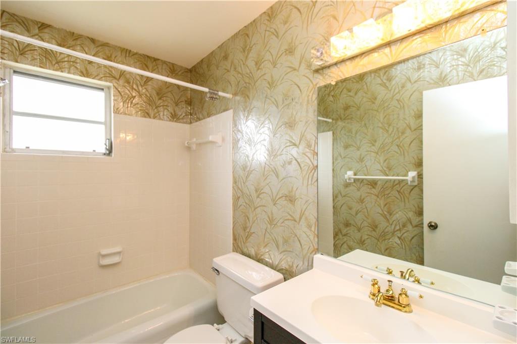 729 Palm View Drive, Unit D4 Naples, FL 34110 - Photo 16 of 23 a bathroom with a sink a toilet and shower