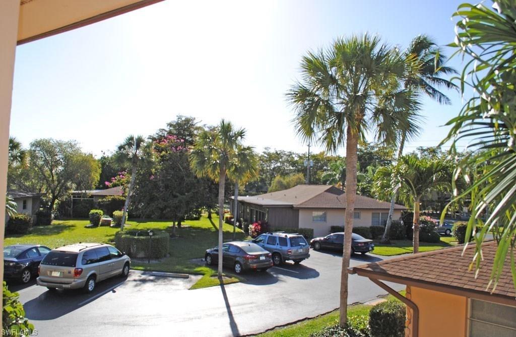 729 Palm View Drive, Unit D4 Naples, FL 34110 - Photo 5 of 23 a view of a swimming pool with a patio