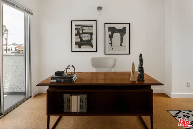 a view of a dining room with furniture and window