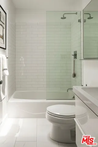 a bathroom with a toilet and shower