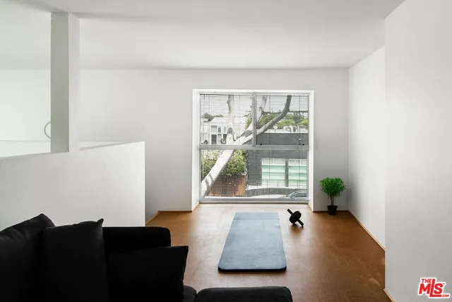 a balcony with table and chairs