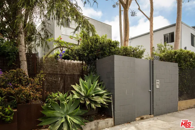 a picture of a room with a bench and a window