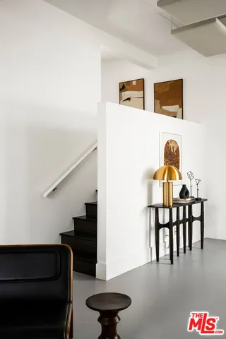 a view of a hallway with chairs
