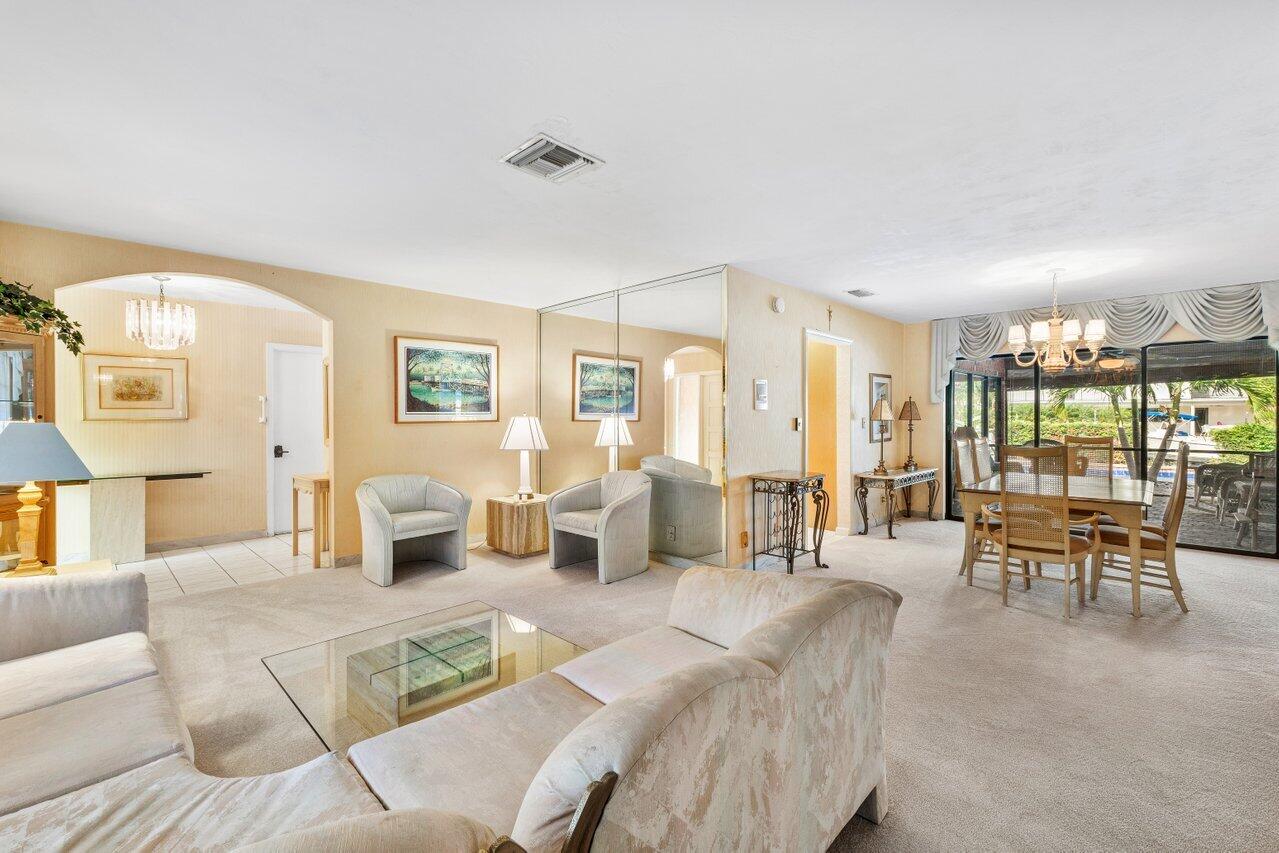 3163 Northeast 8th Avenue Boca Raton, FL 33431 - Photo 11 of 31 a living room with furniture and a large window