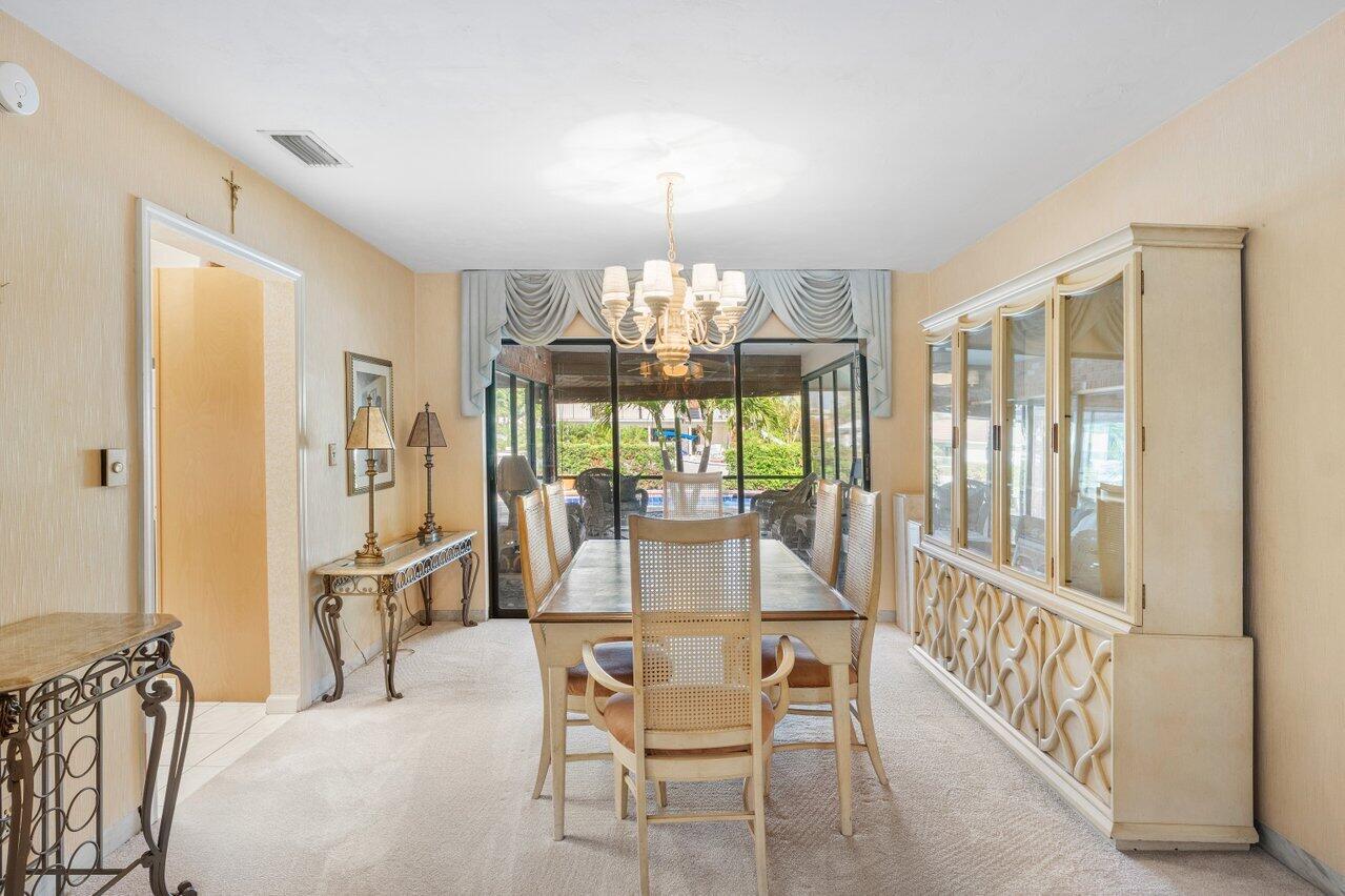 3163 Northeast 8th Avenue Boca Raton, FL 33431 - Photo 12 of 31 a view of a dining room with furniture window and outside view