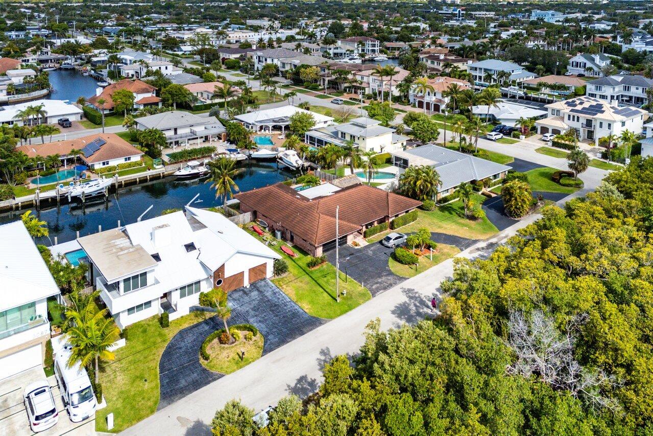 3163 Northeast 8th Avenue Boca Raton, FL 33431 - Photo 30 of 31 an aerial view of residential houses with outdoor space