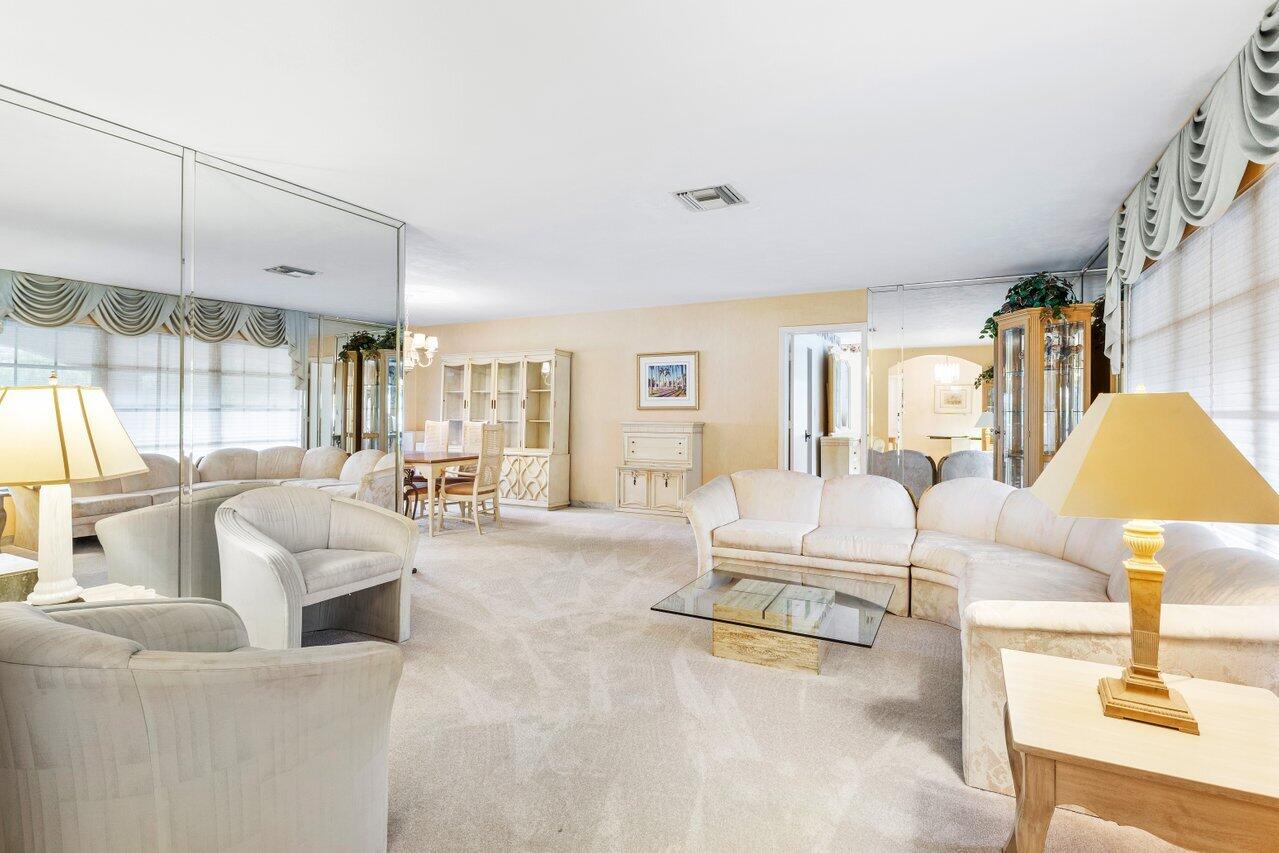 3163 Northeast 8th Avenue Boca Raton, FL 33431 - Photo 9 of 31 a living room with furniture and a large window