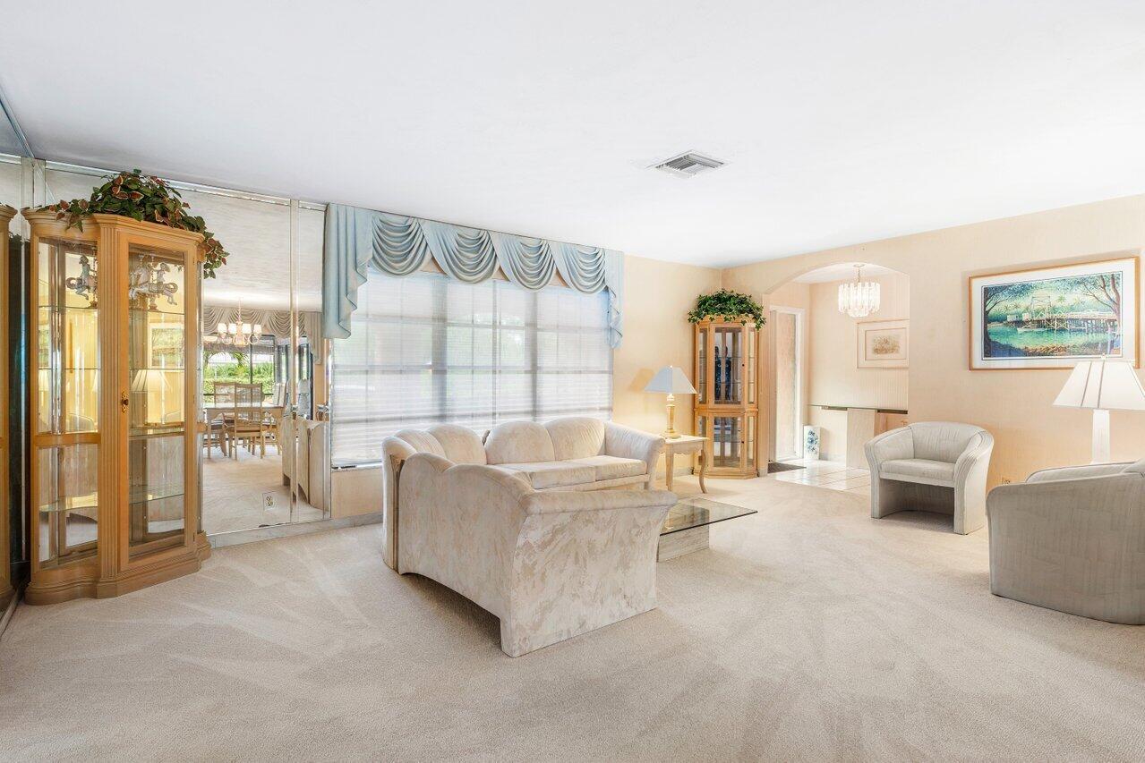 3163 Northeast 8th Avenue Boca Raton, FL 33431 - Photo 10 of 31 a living room with furniture and a large window