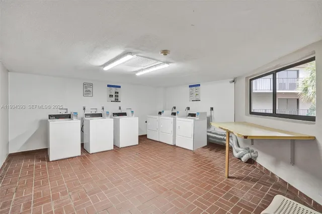 a view of kitchen with furniture and window