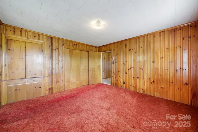 a view of a room with a wooden walls