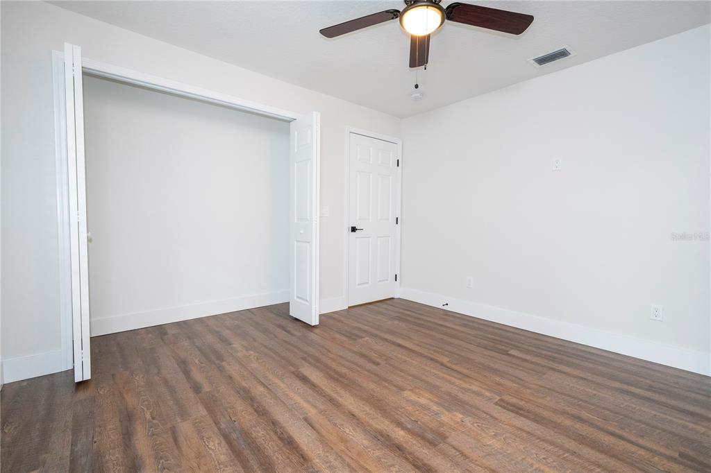 1124 Munster Street Orlando, FL 32803 - Photo 20 of 64 a view of an empty room with wooden floor