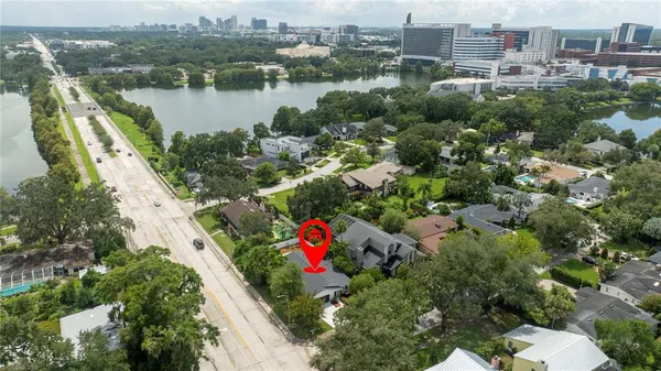 an aerial view of residential building and lake