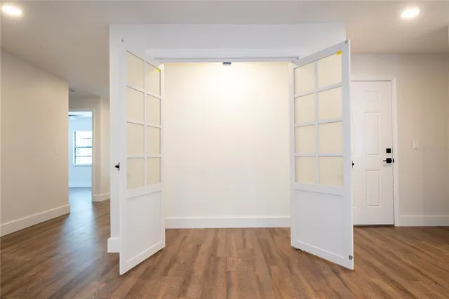 a bathroom with a sink a toilet a mirror and shower