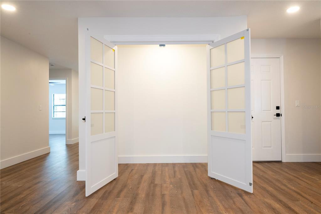 1124 Munster Street Orlando, FL 32803 - Photo 45 of 64 wooden floor in an empty room with a window