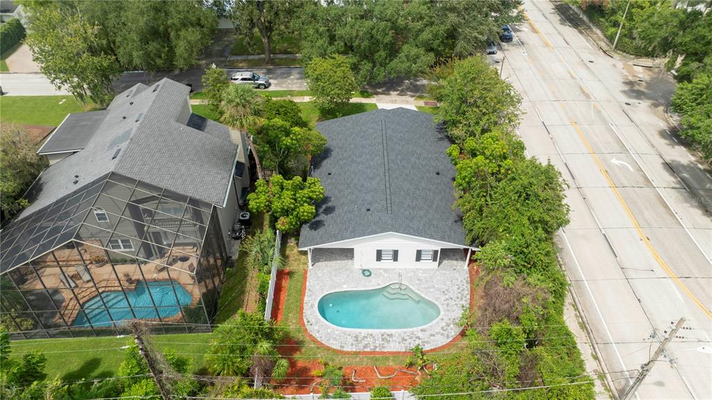 1124 Munster Street Orlando, FL 32803 - Photo 7 of 64 an aerial view of a house with outdoor space pool seating area and yard