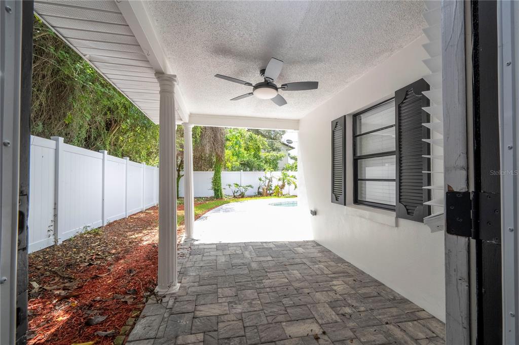 1124 Munster Street Orlando, FL 32803 - Photo 8 of 64 a view of a porch with a floor to ceiling window and garden