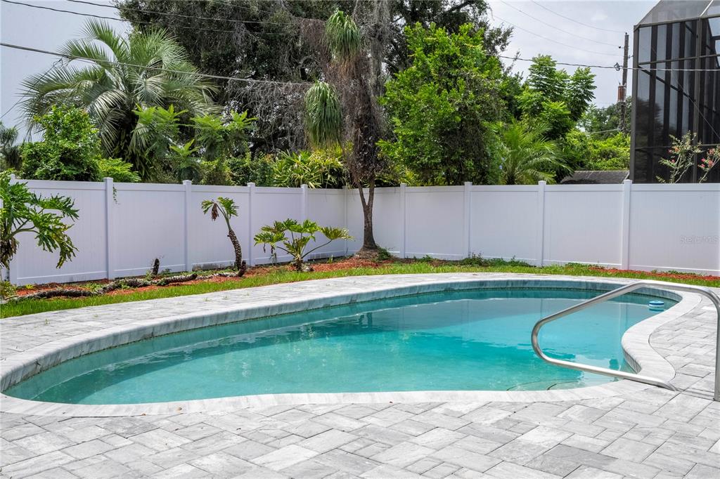 1124 Munster Street Orlando, FL 32803 - Photo 9 of 64 a view of a swimming pool with a yard