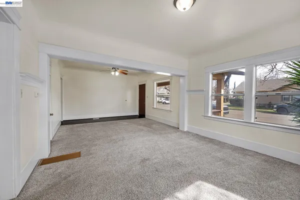 a view of an empty room with a window