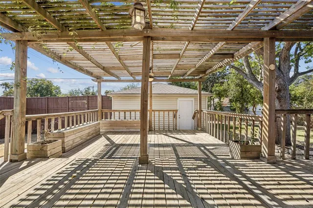 a view of a balcony with wooden floor