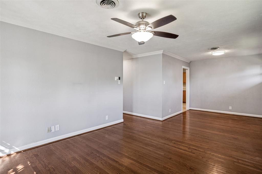 601 Ridgedale Drive Richardson, TX 75080 - Photo 4 of 26 a view of an empty room with wooden floor
