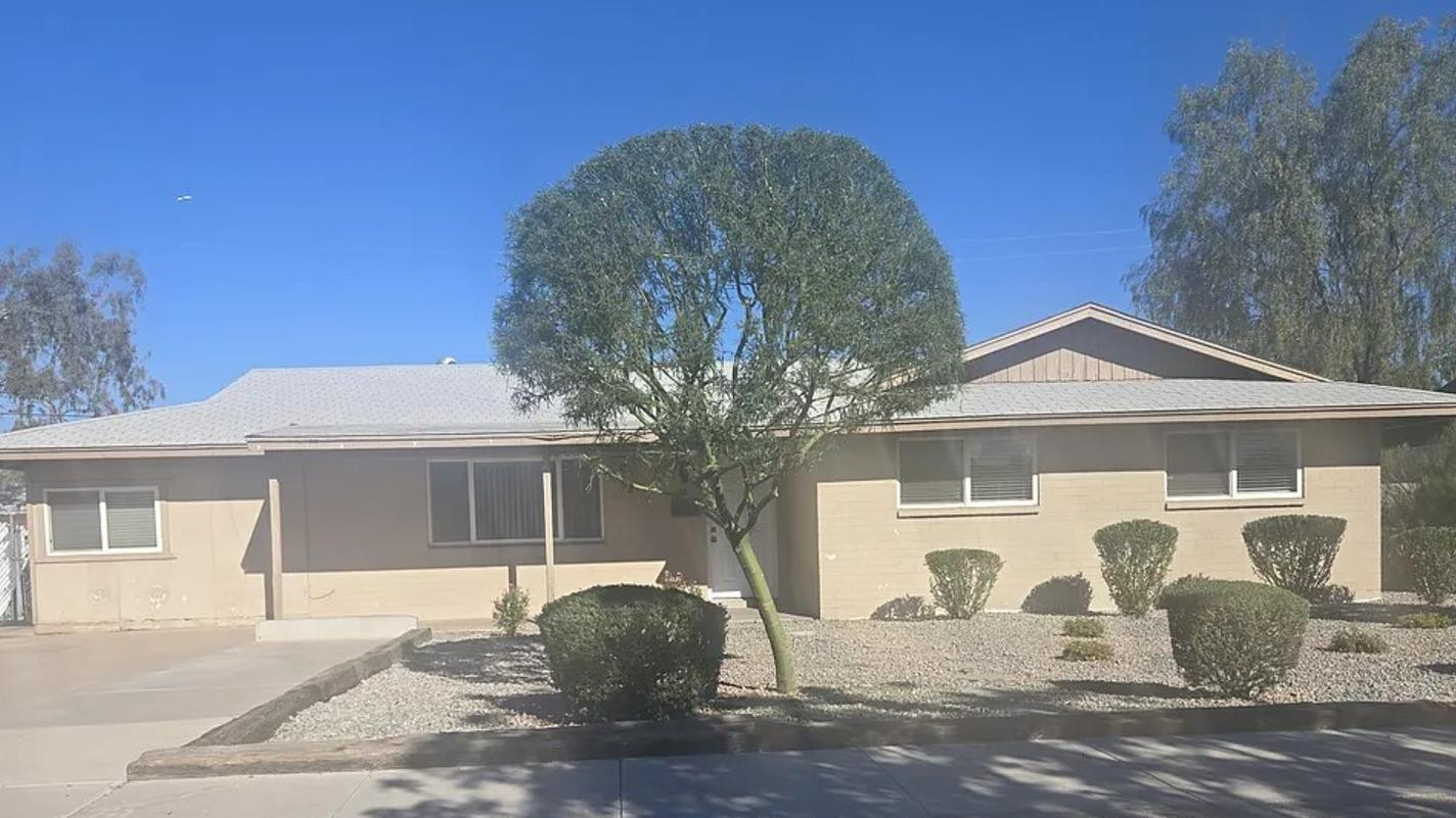 620 East Broadway Lane Tempe, AZ 85282 - Photo 1 of 15 a front view of a house with a yard