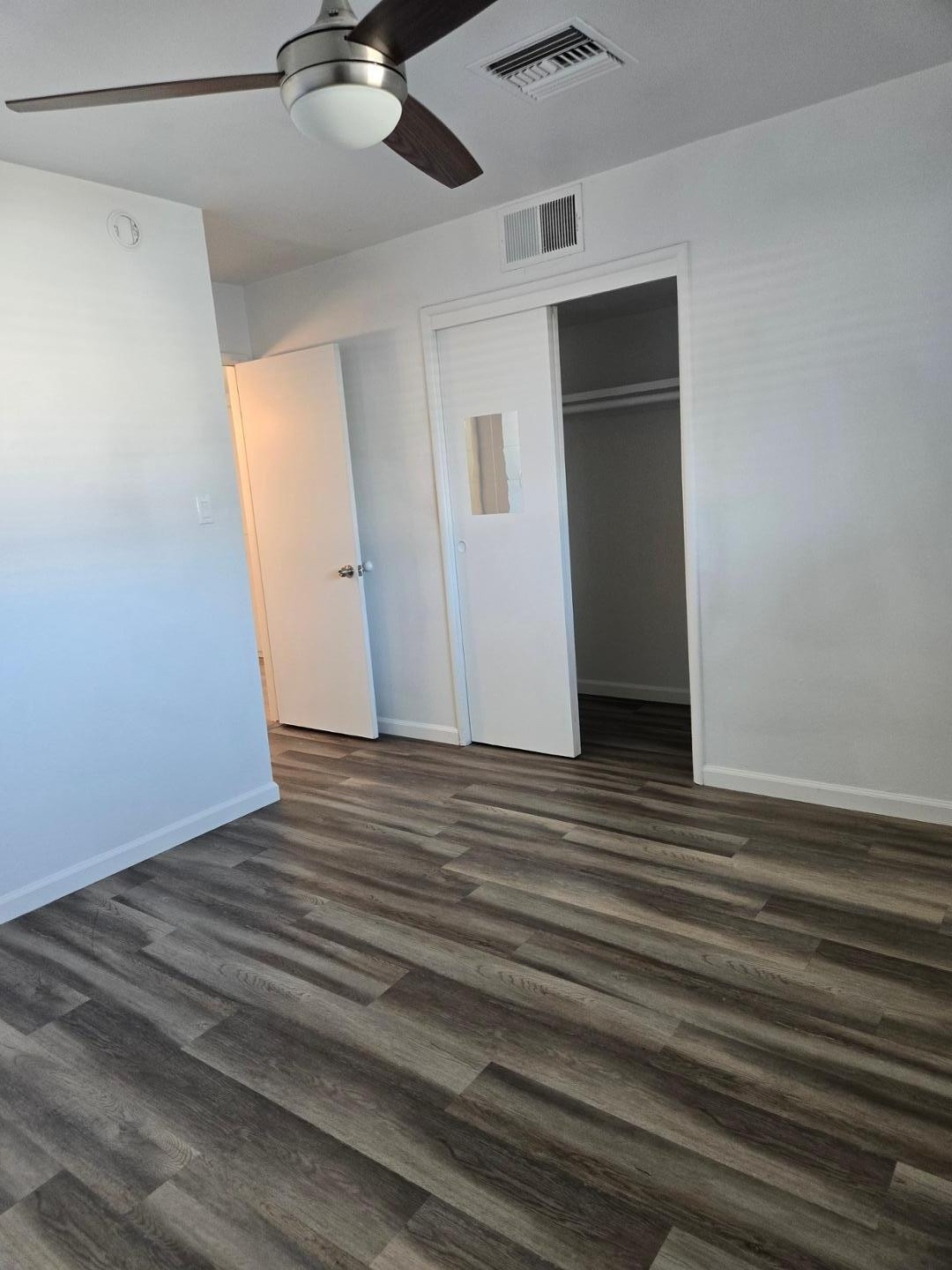 620 East Broadway Lane Tempe, AZ 85282 - Photo 11 of 15 a view of a livingroom with wooden floor and staircase