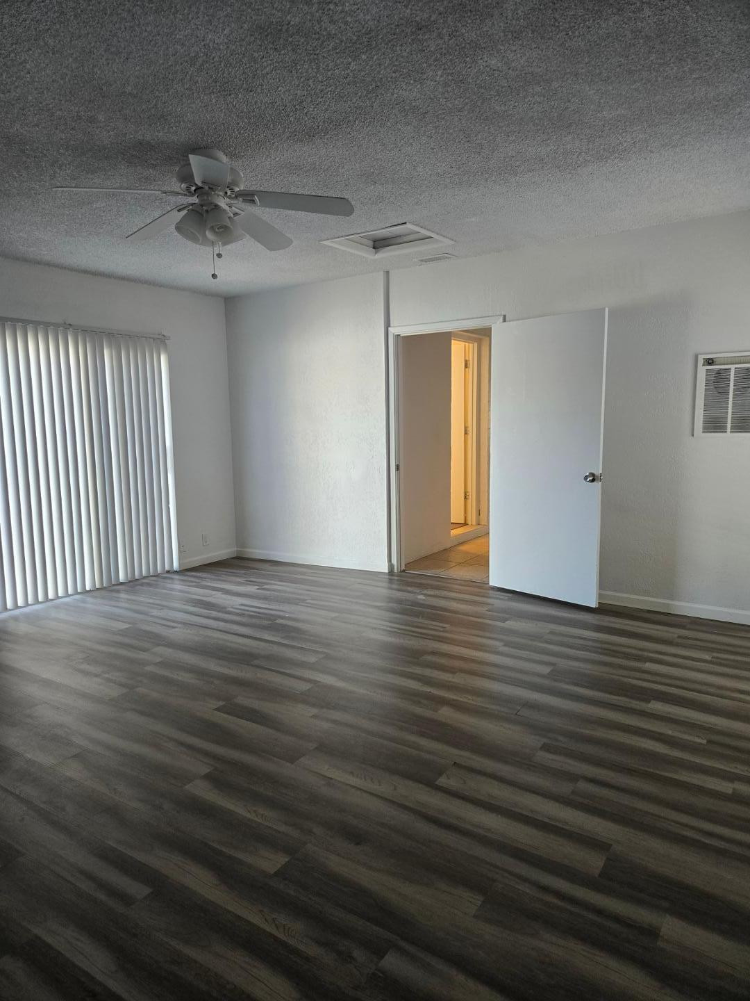 620 East Broadway Lane Tempe, AZ 85282 - Photo 14 of 15 an empty room with wooden floor and windows